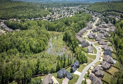 Landscape view over a neighborhood of residential homes near greenery